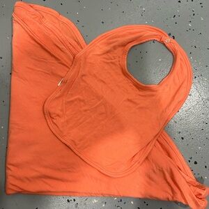 NWOT Kate Quinn blanket and bib set. Coral colors